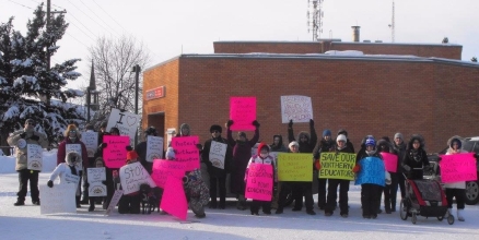 Marching w/megaphone against Aurora College Program cuts!