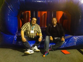Nahhed Nenshi and Brad playing in bounce houses in Inuvik